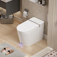 Modern white toilet in a bathroom with wooden floor and tiled walls.